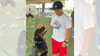 A photo of a Kids Camp attendee playing with an adoption dog.