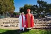 A photo of Mother Kellie Grace and Bishop John H. Taylor standing in front of the church's new labyrinth.